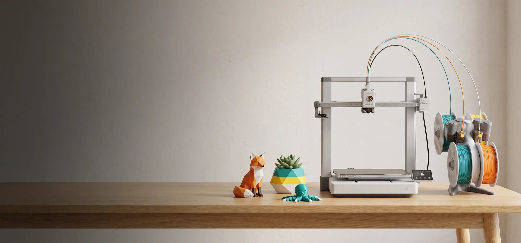 Bambu Lab A2L Combo 3D printer with AMS Lite on a wooden table
