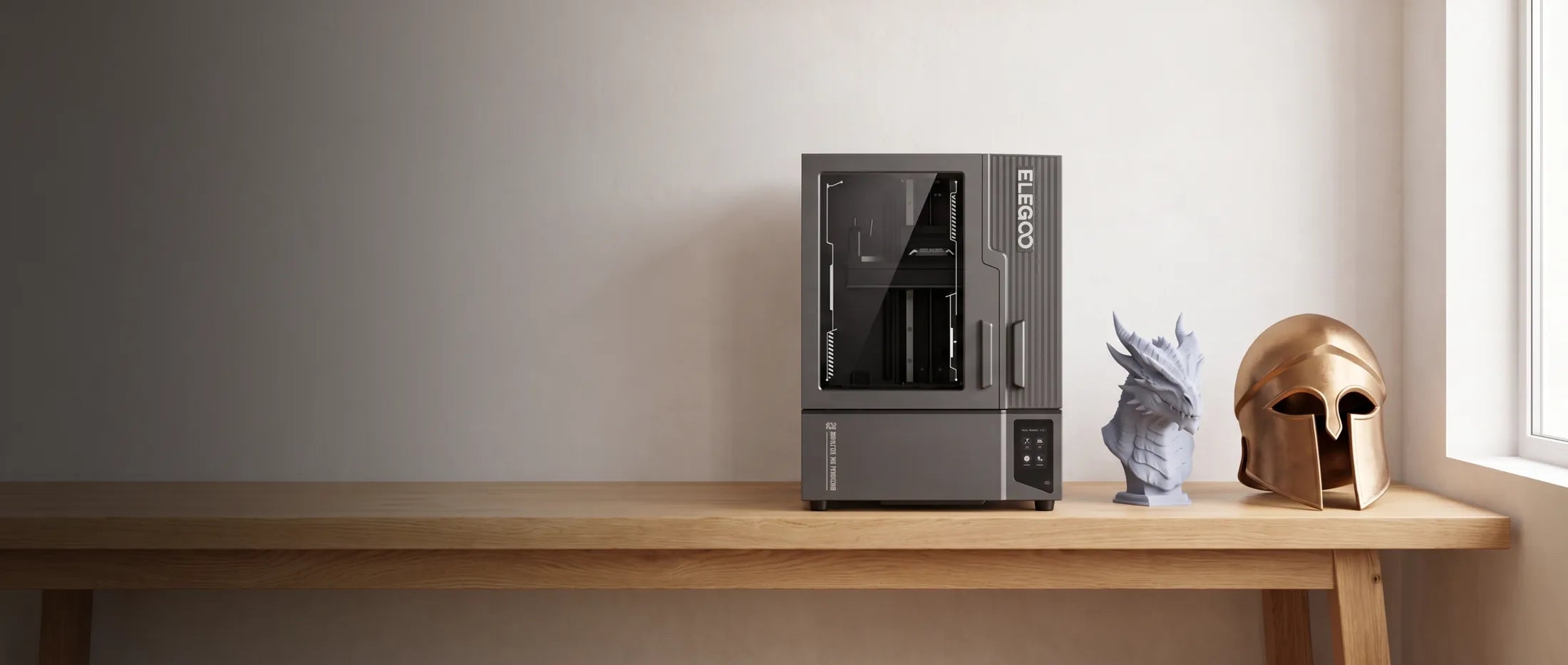 Elegoo Jupiter 2 large-format resin 3D printer on a wooden bench with a printed helmet and bust