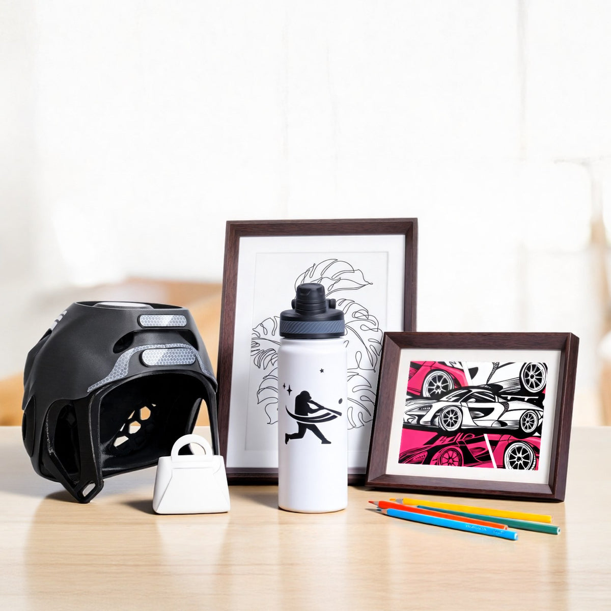 Cut vinyl artwork, decals on a helmet and a bottle made with the Bambu Lab cutting module